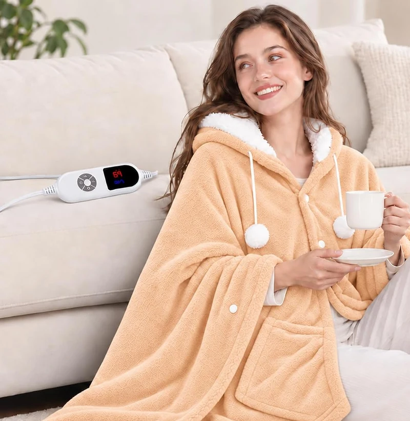 Apricot MENOLY hooded heated shawl worn while relaxing with a cup